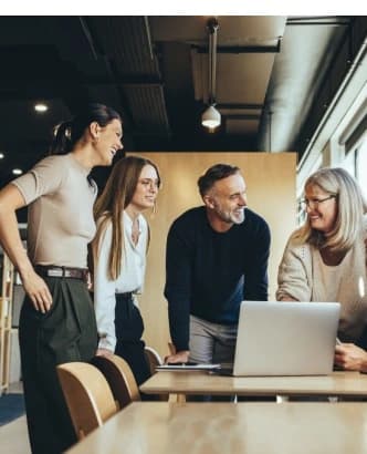 Team collaborating over a laptop